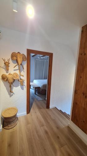 a hallway with a room with a bed and a mirror at Casa Playa Javea in Jávea