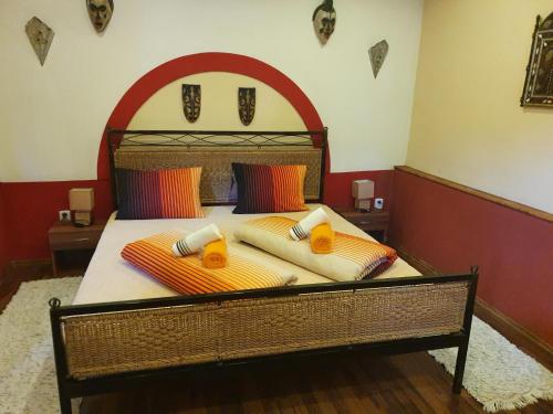 a bed with two pillows on it in a room at Resort Svět in Úžice