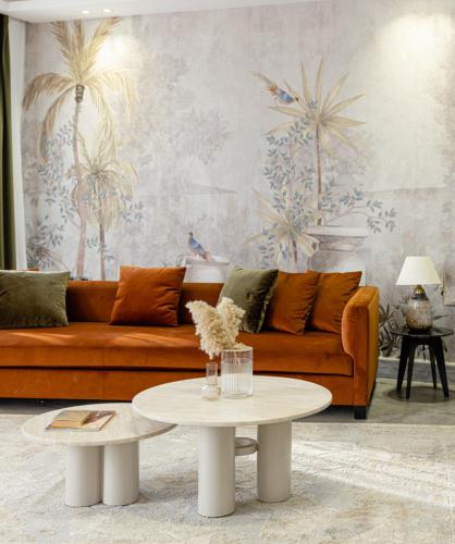 a living room with a couch and a table at Boutique Nest in New Cairo in Cairo