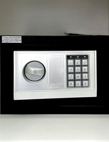 a black and white microwave with a control panel at La Casa de Armenie in Yerevan