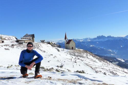 a man standing on top of a snow covered mountain at Thalhofer Hof in Lazfons