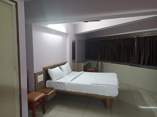 Ein Bett oder Betten in einem Zimmer der Unterkunft Padilgate Luxuryinn