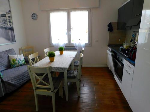a kitchen with a table and chairs in a kitchen at VCE House in Tessera