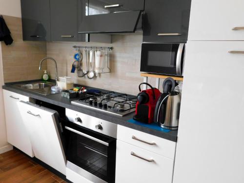 a kitchen with a stove and a counter top at VCE House in Tessera