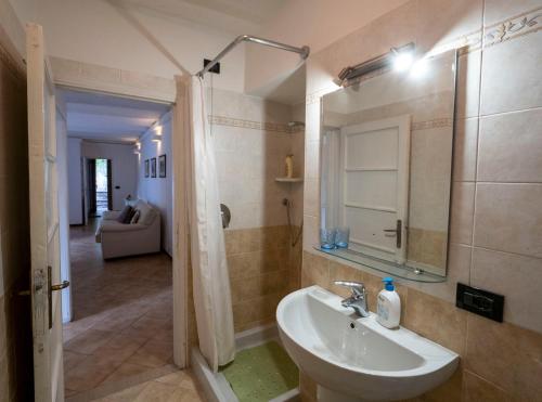 a bathroom with a sink and a mirror at Villa Albertina in Varenna
