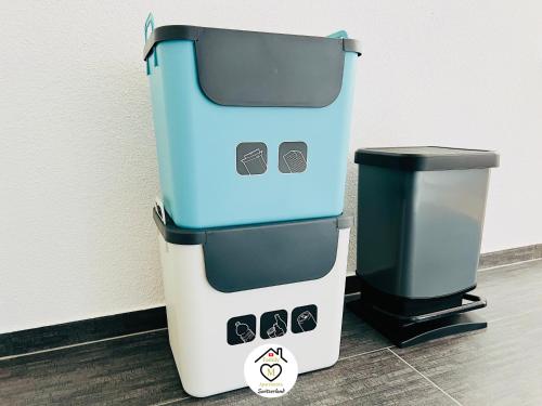 a trash can sitting next to a trash can at Family M Apartments 4-5-6 in Kappel bei Olten