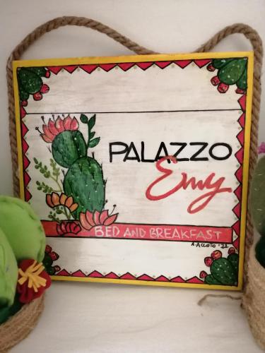 a sign on a wall with a cactus at Palazzo Emy in Lecce