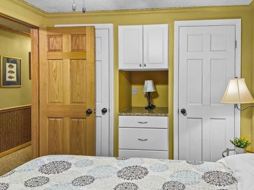 a bedroom with a bed and a closet and a door at ML358 Calm And Comfortable Quick Access To Trails WiFi Parking in Snowshoe