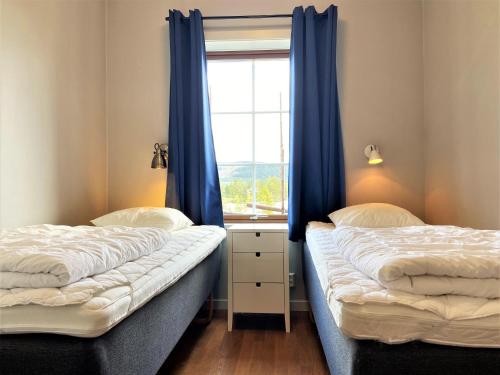 Кровать или кровати в номере AGO Katrinagården