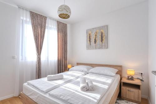 Llit o llits en una habitació de Apartments Perla