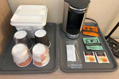a lunch tray with food and a coffee maker at Econo Lodge Airport Quebec in Quebec City