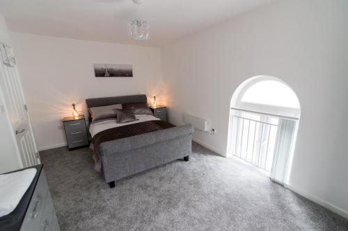 Katil atau katil-katil dalam bilik di Nazarene apartments in Leeds