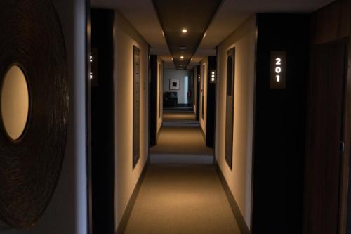 a hallway of a hotel with a long corridor at Urban Hotel & Spa in Kenitra