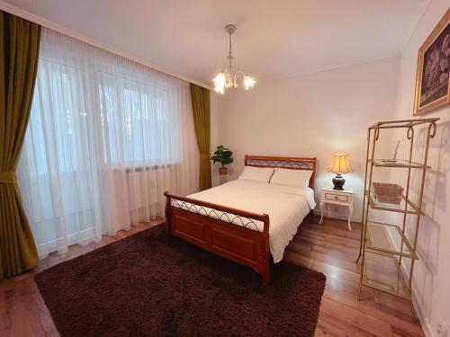 a bedroom with a bed and a ladder in it at Niran Apartament in Oradea