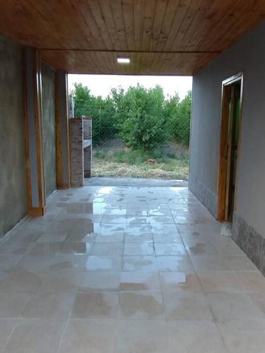 an empty hallway of a house with a large window at Departamento El Renuevo in Vista Flores