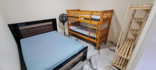 Giường trong phòng chung tại Sobrado Residencial Pereira Matinhos
