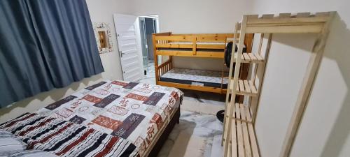 Giường trong phòng chung tại Sobrado Residencial Pereira Matinhos