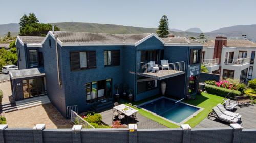 an aerial view of a house with a swimming pool at The Whale's Tale Guesthouse in Hermanus