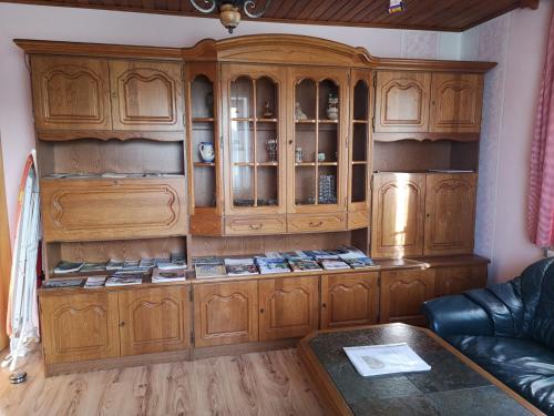 a large wooden cabinet in a living room at Stoagrawihof 