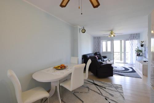a living room with a white table and chairs at Back To Nature - Apartment Borodin in Stranići kod Lovreča
