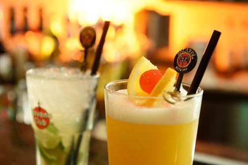 two drinks sitting on a table with fruit on top at Best Western Plus Parkhotel Maximilian Ottobeuren in Ottobeuren