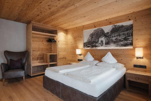 Un pat sau paturi într-o cameră la Gourmet Hotel Gran Ander