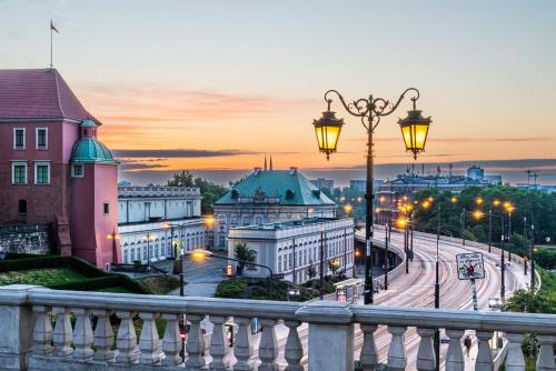 a view of a city at sunset at MARIENSZTAT 8 Aparthotel in Warsaw