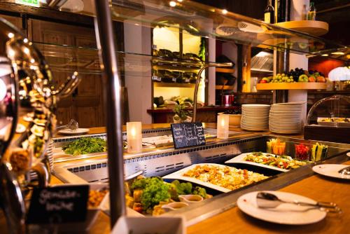 a buffet line with many different types of food at Hotel BEI SCHUMANN in Kirschau