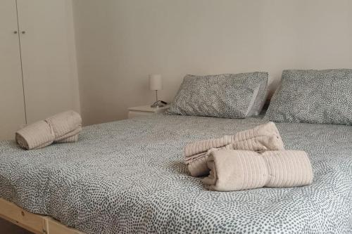 A bed or beds in a room at Incantevole Appartamento Via Molino Delle Armi
