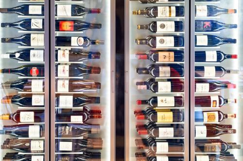 a wine cellar filled with lots of wine bottles at Best Western Plus Hôtel Le Rhénan & Restaurant Chez Claude in Dorlisheim