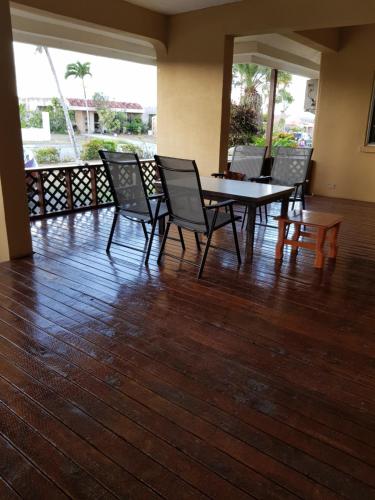 a dining room with a table and chairs on a wooden floor at DK Home 단독 감성주택 in Afetna