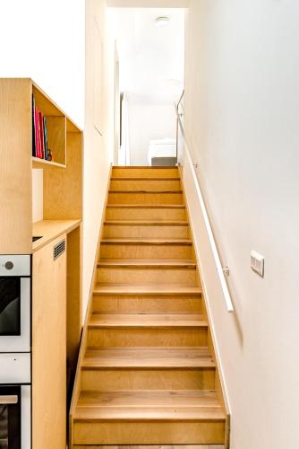 a staircase in a house with wooden floors at Apartment Brno in Brno