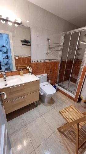 a bathroom with a toilet and a sink and a shower at casa luxury 2 nudista in Vera