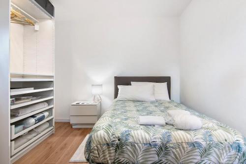 a bedroom with a bed and a closet at Fogazzaro Lake View Apartment in Oria