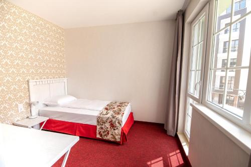 Ένα ή περισσότερα κρεβάτια σε δωμάτιο στο Glamping Alliance Hotel
