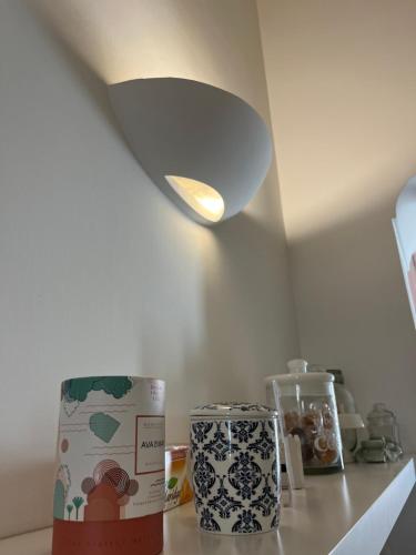 a light on top of a counter in a kitchen at Serapisuite in Pozzuoli