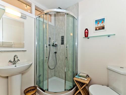 a bathroom with a shower and a sink and a toilet at Inchgarry Court in North Berwick