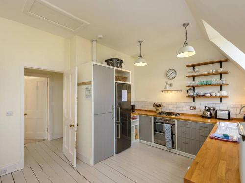 a kitchen with a refrigerator and a counter top at Forthview in North Berwick