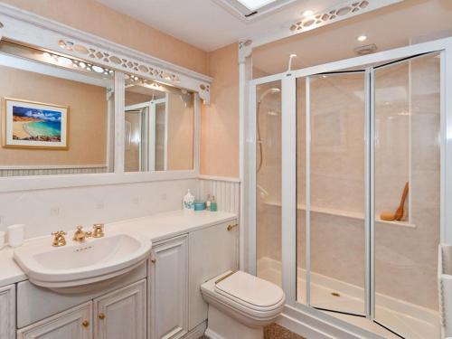 a bathroom with a sink toilet and a shower at Greylag Cottage in Gullane