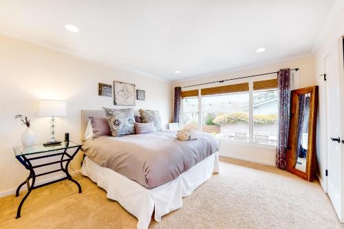 a bedroom with a bed and a window at Pradera Estate in Carmel