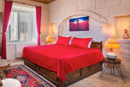 Megaron Cave Hotel Cappadociaにあるベッド