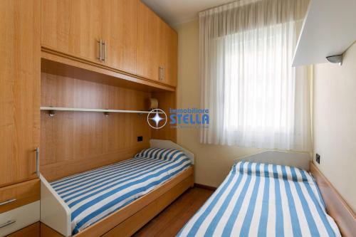 En eller flere senger på et rom på Condominio Adriatico