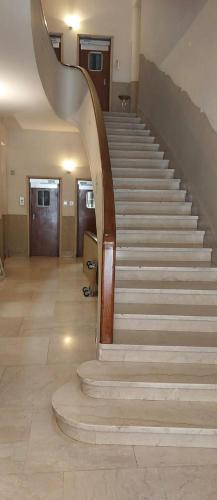 a stairway in a building with a spiral staircase at Pariolina in Rome