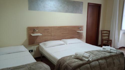 Hotel Eliseo Napoliにあるベッド
