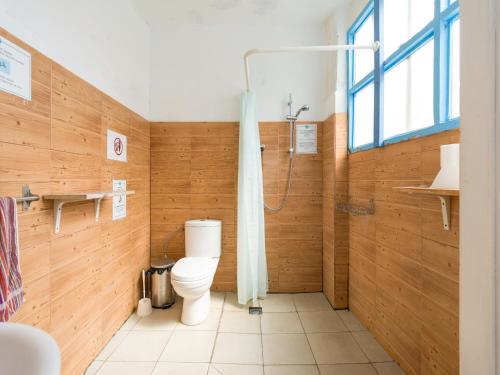 a bathroom with a toilet and a shower at Jungle House in Las Palmas de Gran Canaria