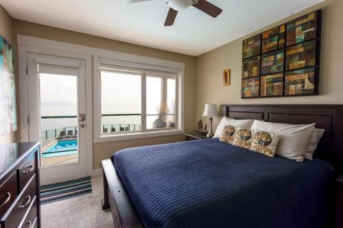 a bedroom with a bed with two teddy bears on it at Sunrise Cove Apt at Inn of The Sea in Ladysmith