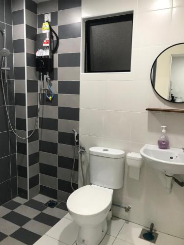 a bathroom with a toilet and a sink at Ipoh Homestay - Manhattan Condominium with Water Park & Leisure Facilities in Ipoh