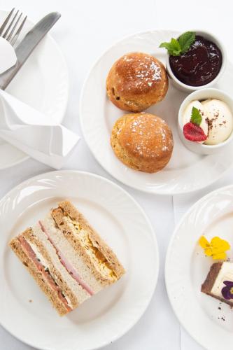 three plates of food on a white table at Woodlands Lodge Hotel in Bartley