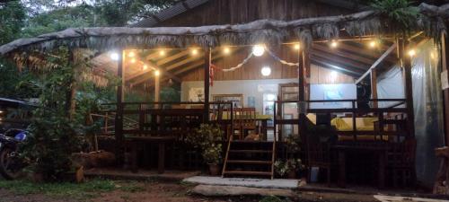 a house with a room with chairs and lights at Hidden Paradise Lodge in Drake