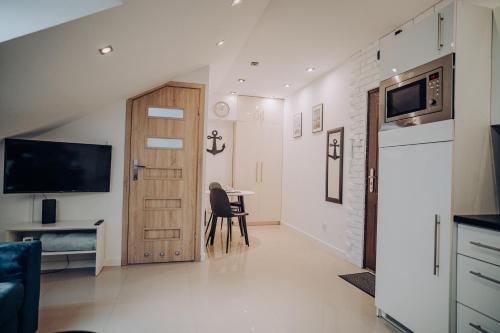 Η κουζίνα ή μικρή κουζίνα στο Apartament Kotwica